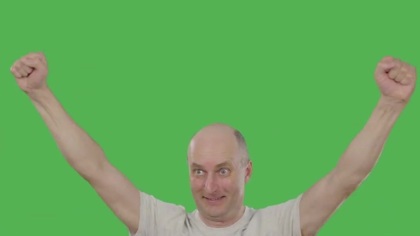 Man Football Fan Raising Hands up while Watching Soccer Match on Green Background alt