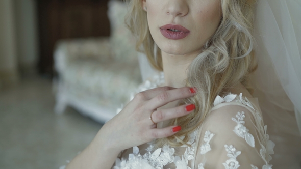 Portrait of Gorgeous Bride Resting on Sofa and Thinking alt