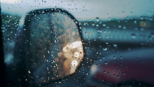 Windscreen at the Time of the Rain. Mirror of Car alt