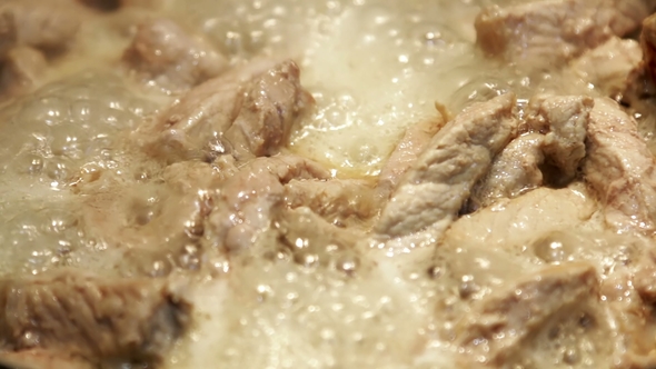 Roast Pork in a Pan in Oil and Stir