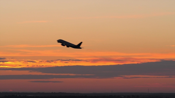 Airplane Taking Off Against the Evening Sky alt