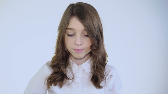 Pretty Young Girl Seriously Looking at Camera in Hat alt