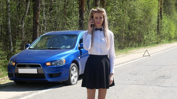 A Girl with a Broken Car Calling For Help