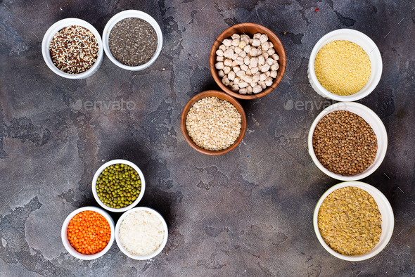 Superfoods and cereals selection in bowls on stone background - Stock Photo - Images