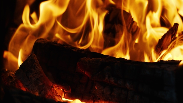 Fire Sparks Moving On Dark Black Background Coming From Brightly