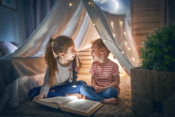 children are reading a book - Stock Photo - Images
