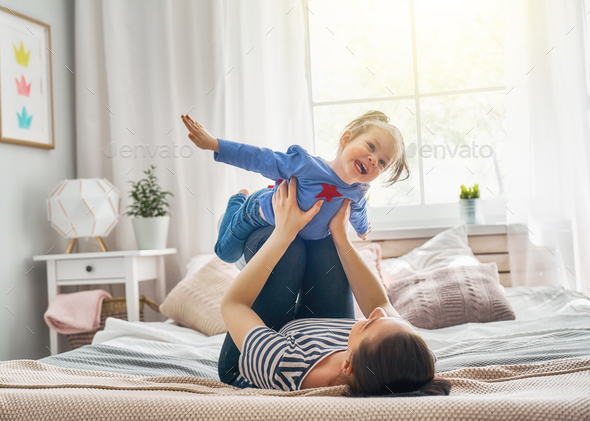 Mom and her daughter are playing - Stock Photo - Images