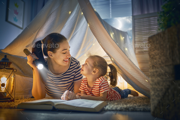 Mom and child reading a book - Stock Photo - Images