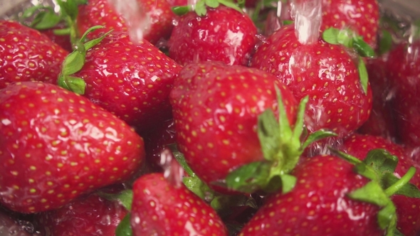 on a Strawberry Under Drops of Water