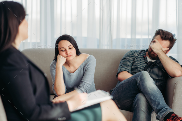Stressed couple patients at psychologist reception - Stock Photo - Images