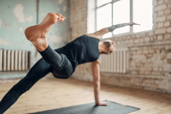 Yoga training in studio with grunge interior - Stock Photo - Images