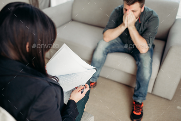 Sad patient at psychologist, psychology support - Stock Photo - Images