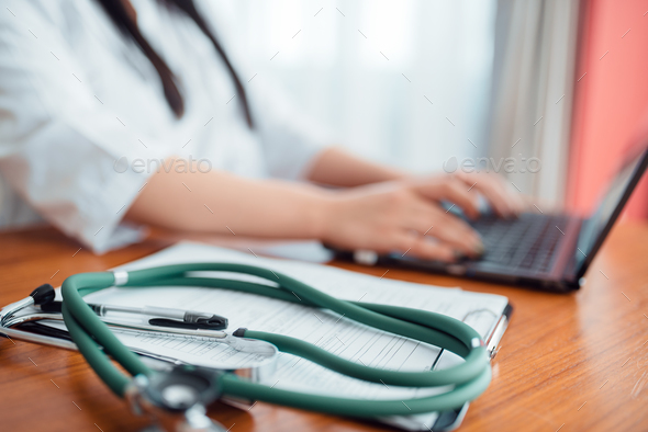 Stethoscope on wooden table, family doctor concept - Stock Photo - Images