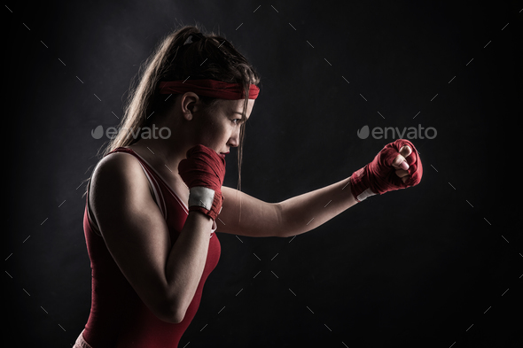 Female boxer in red boxing bandages and sportswear Stock Photo by NomadSoul1