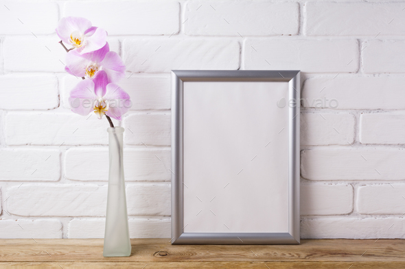 Silver frame mockup with tender pink orchid - Stock Photo - Images