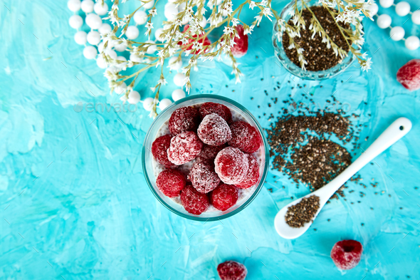 Healthy chia pudding with raspberries in glass - Stock Photo - Images