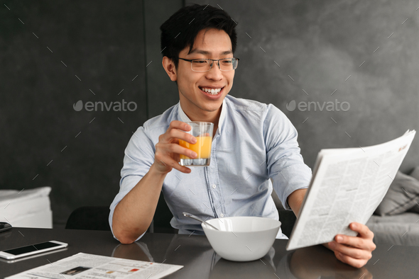 Portrait of a friendly young asian man - Stock Photo - Images