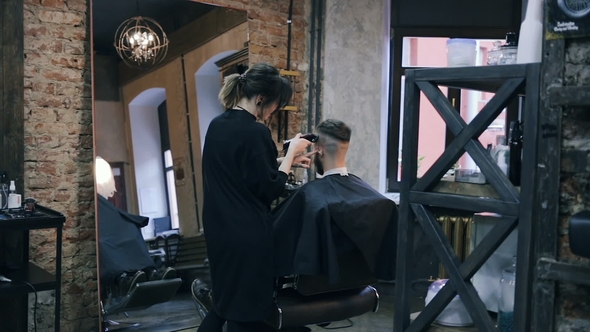 Girl the Hairdresser Shears the Guy with a Clipper.