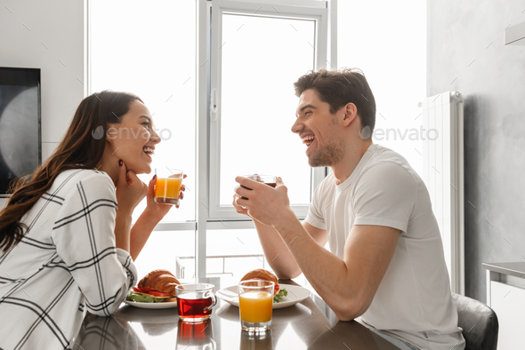 Portait of beautiful happy family man and woman looking at each - Stock Photo - Images