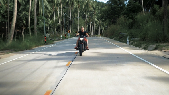 Person Riding Without Helmet Young Man Without Helmet Riding His Orange Motorcycle, Stabilized Shot ...