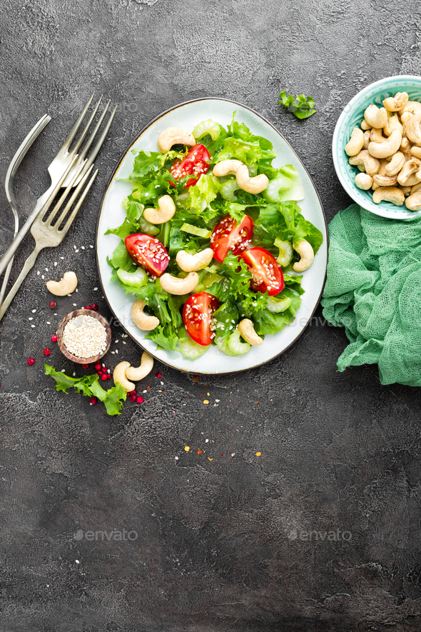 Salad with fresh vegetables and nuts - Stock Photo - Images