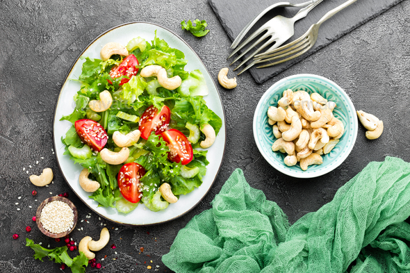 Salad with fresh vegetables and nuts - Stock Photo - Images