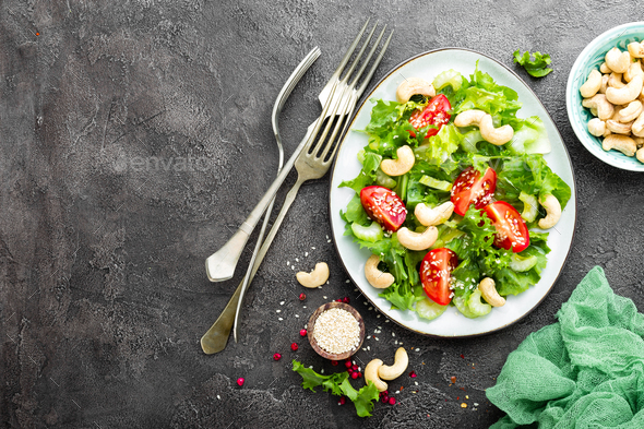 Salad with fresh vegetables and nuts - Stock Photo - Images