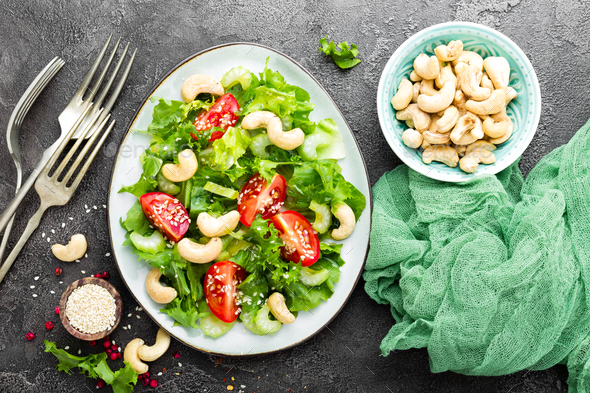 Salad with fresh vegetables and nuts - Stock Photo - Images
