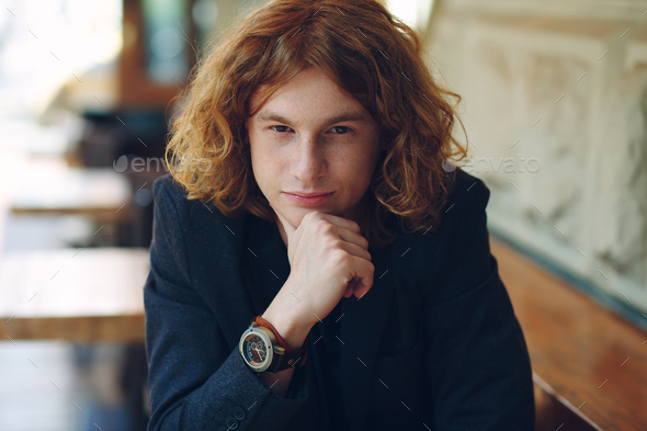 Portrait of fashionable reddish young man posing - Stock Photo - Images