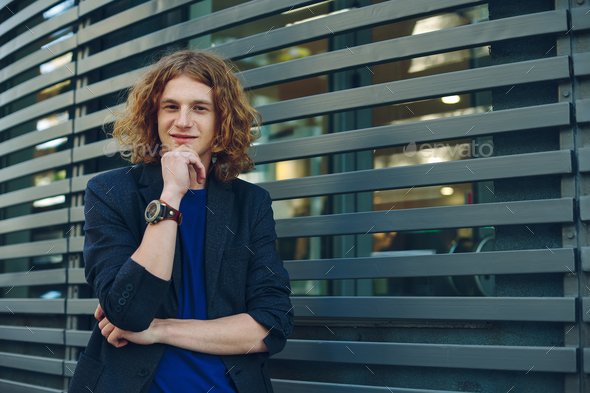 Portrait of red haired man over urban futuristic background - Stock Photo - Images