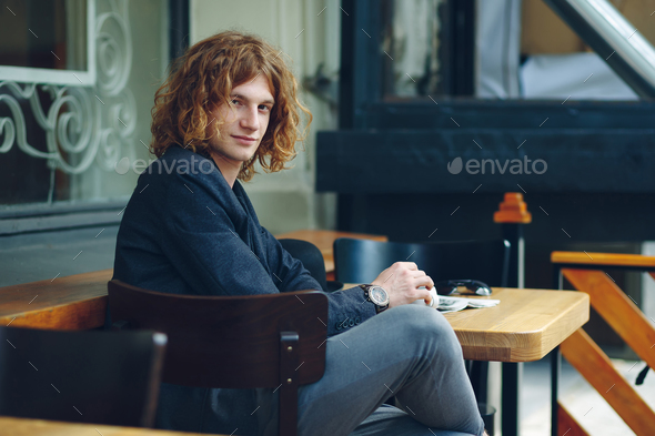Portrait interesting reddish man posing with coffee - Stock Photo - Images
