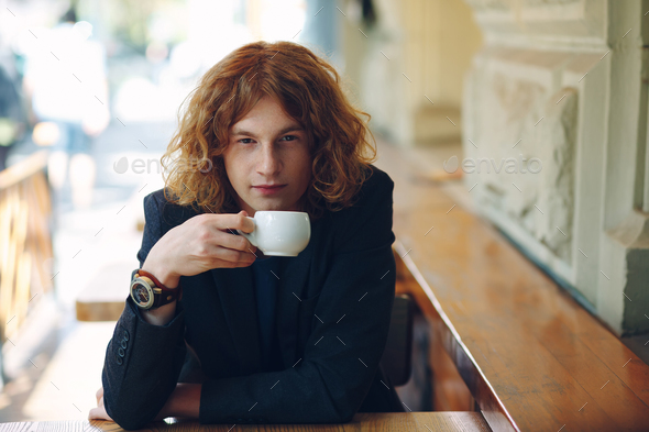 Portrait fashionable reddish man drinking coffee - Stock Photo - Images