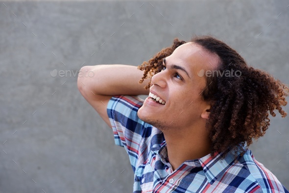cool guy looking up with hand in hair