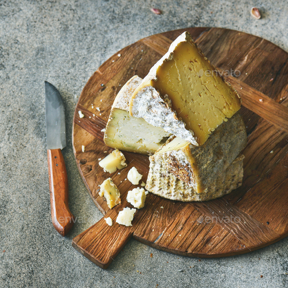 Cheese assortment on board, close-up, vertical composition - Stock Photo - Images