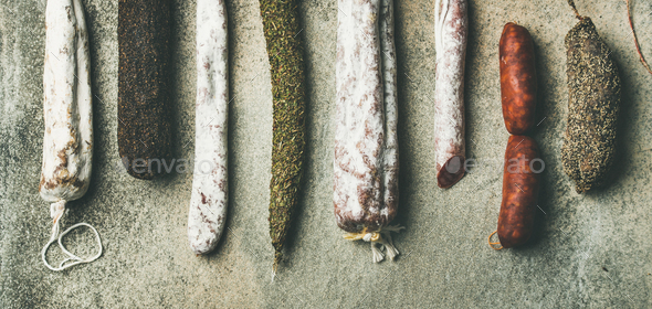 Variety of Spanish or Italian cured meat sausages, wide composition - Stock Photo - Images