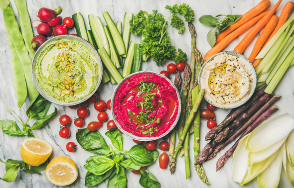 Healthy summer vegan snack plate with hummus and vegetables - Stock Photo - Images