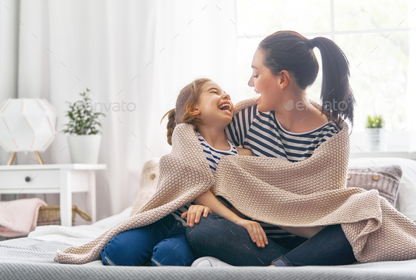 Family playing under blanket - Stock Photo - Images