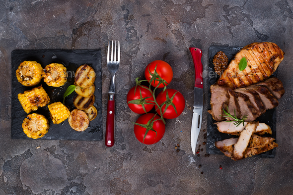 Fresh three types of grilled steak on slate plate with herbs - Stock Photo - Images