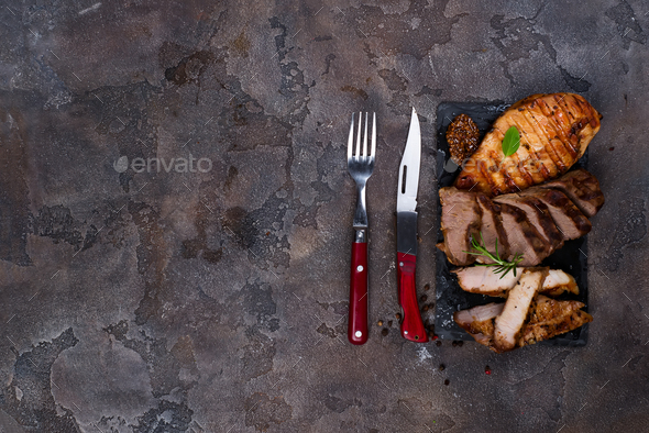 Fresh three types of grilled steak (chicken, pork, beef) on slate plate with herbs - Stock Photo - Images