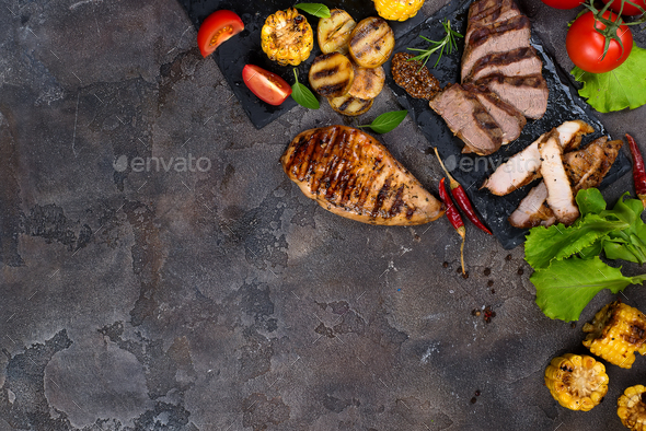 Fresh three types of grilled steak on slate plate with herbs - Stock Photo - Images