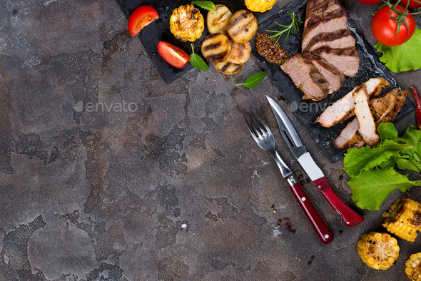 Fresh three types of grilled steak on slate plate with herbs - Stock Photo - Images