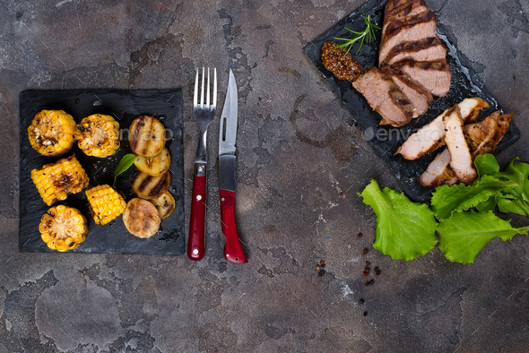 Fresh three types of grilled steak on slate plate with herbs - Stock Photo - Images