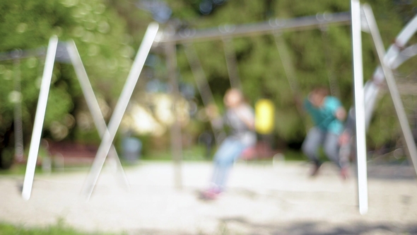 Children on Swings at Playground