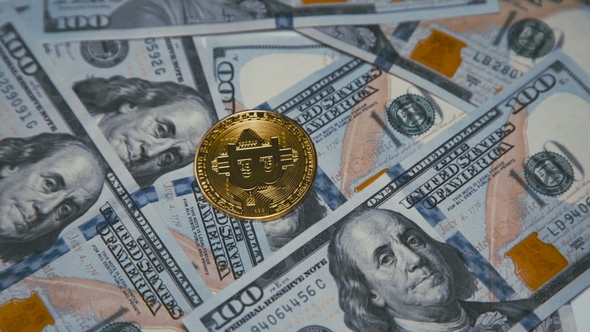 Golden Bitcoin Revolving On Bills Of 100 Dollars By Maximumstock Golden Bitcoin Revolving On Bills Of 100 Dollars Stock Footage