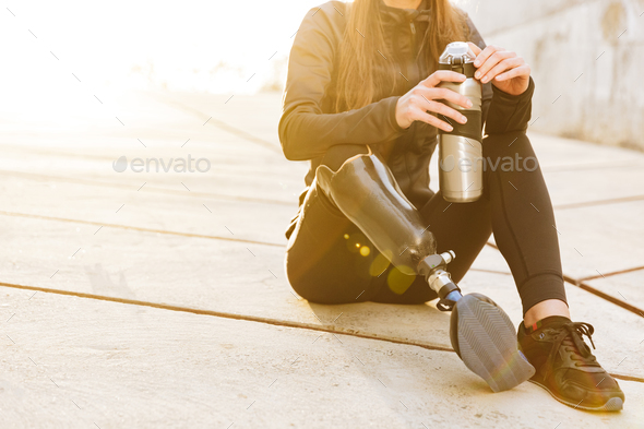Cropped photo of athletic disabled girl with prosthetic leg in s - Stock Photo - Images