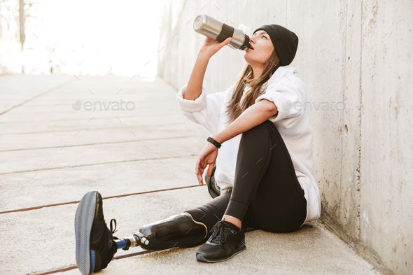 Photo of attractive young handicapped woman having bionic leg in - Stock Photo - Images