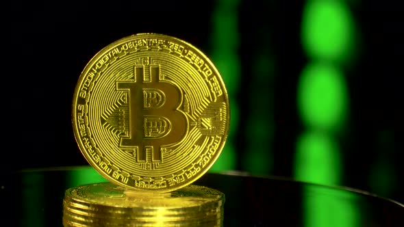 Bitcoin Rotating on Binary Code Blockchain Background
