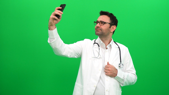 Doctor Taking Selfie on Green Screen