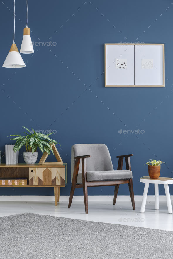 Grey armchair with wooden frame - Stock Photo - Images