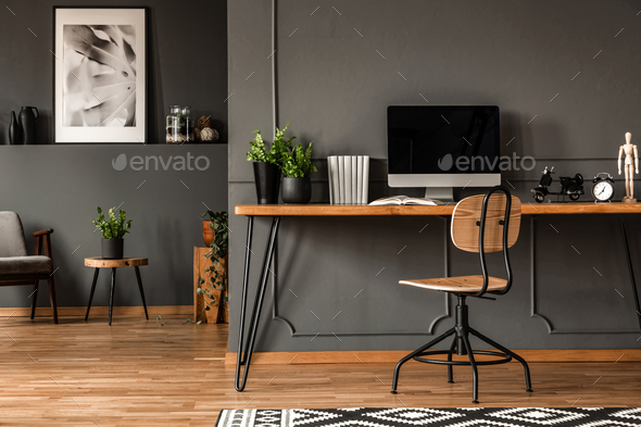 Real photo of an open space interior with black walls and moldin - Stock Photo - Images